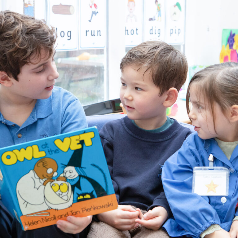 students reading a book together